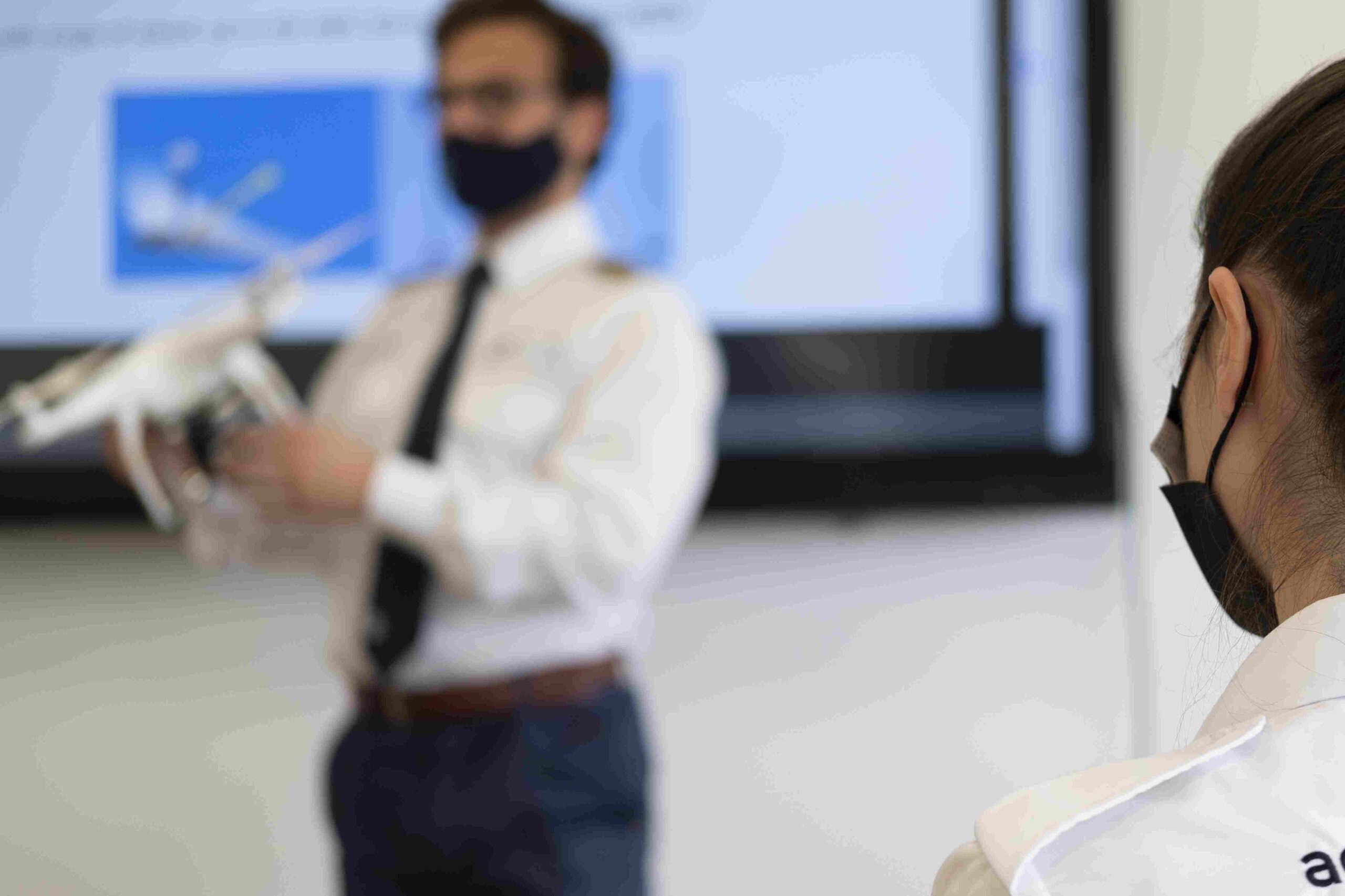 male-with-a-medical-face-mask-holding-a-white-dron-2023-03-03-18-20-01-utc