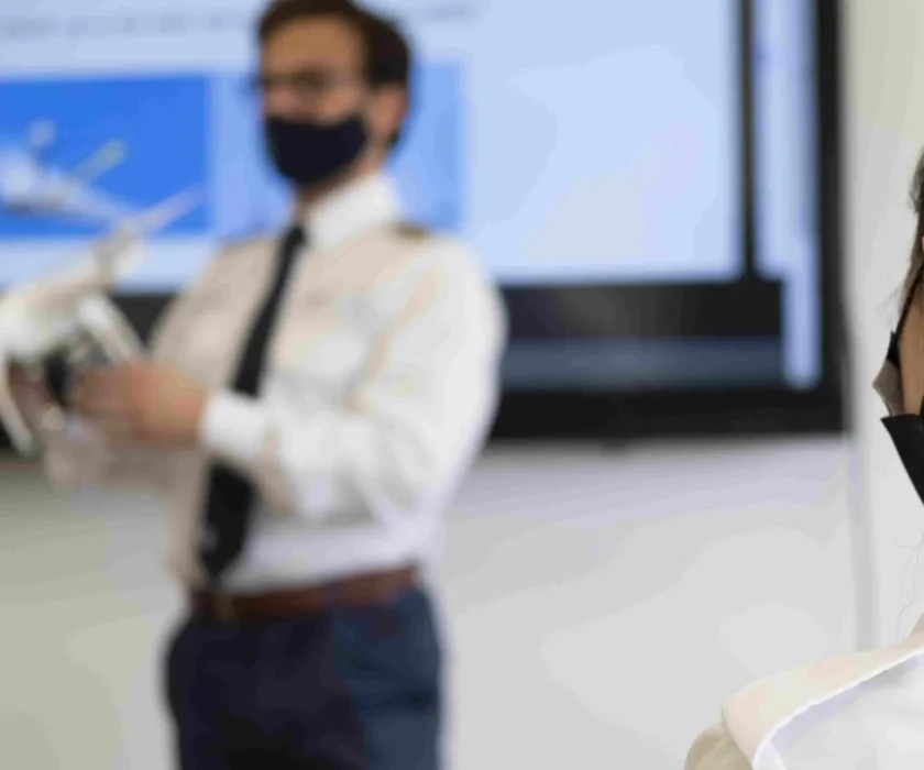 male-with-a-medical-face-mask-holding-a-white-dron-2023-03-03-18-20-01-utc